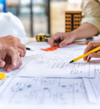 Image,Of,Team,Engineer,Checks,Construction,Blueprints,On,New,Project
